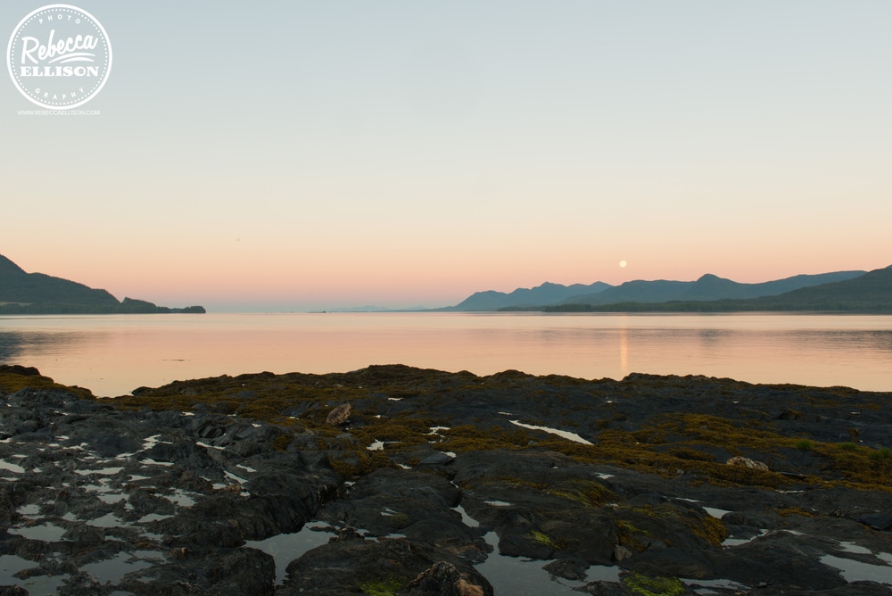Sunrise in Ketchikan Alaska looking out over a rocky beach photography by Rebecca Ellison