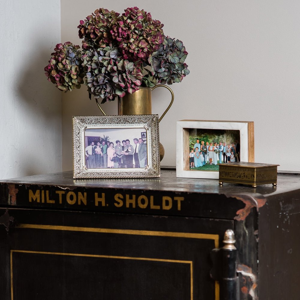  Found in the show room of Sholdt Jewelry in Seattle, is owner, Kalee's grandpa's safe with a family photo from the 80s as well as a current family photo of Kalee's wedding. Showing that this is a family business, and they care about family and relationships. When you buy from Sholdt, you get a jeweler for life, not just a pretty ring. 