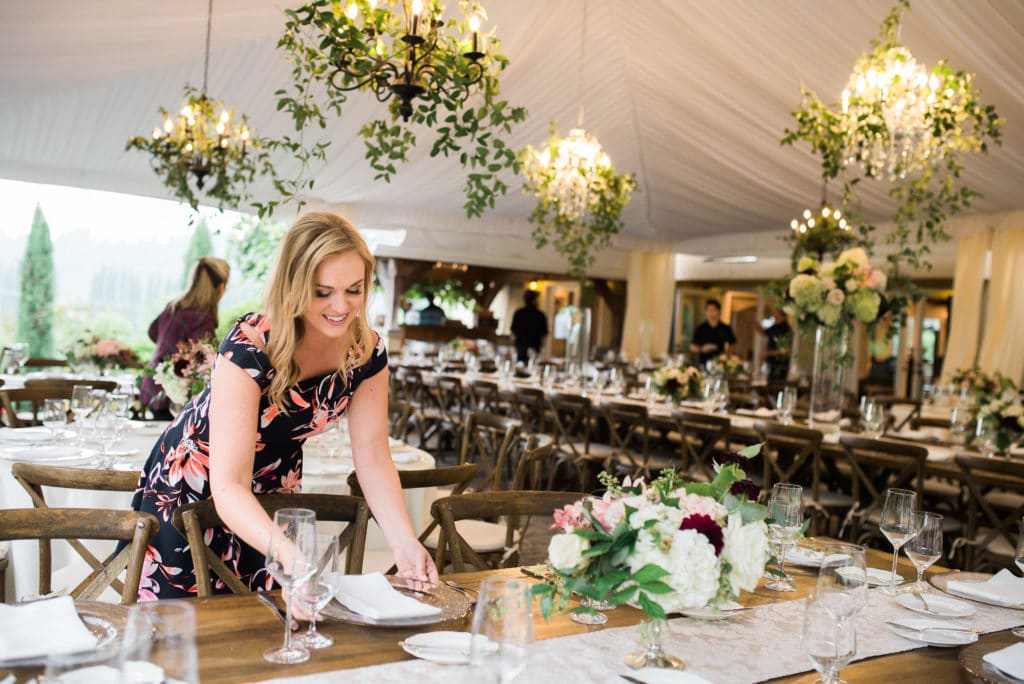 Brand photographer captures Seattle wedding planner setting up a wedding
