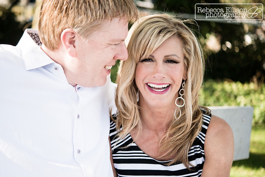 engagement photos of couple laughing together during a Smith Cove Park engagement portrait session photographed by Rebecca Ellison Photography