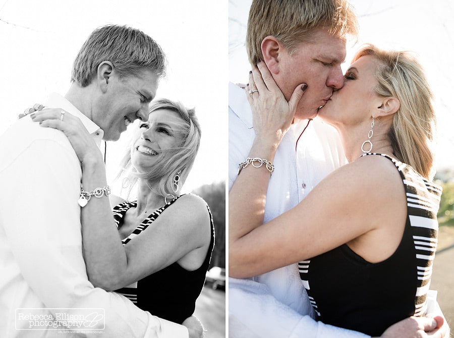 Smith Cove park engagement portraits of a couple kissing in the sunshine photographed by Seattle wedding photographer Rebecca Ellison