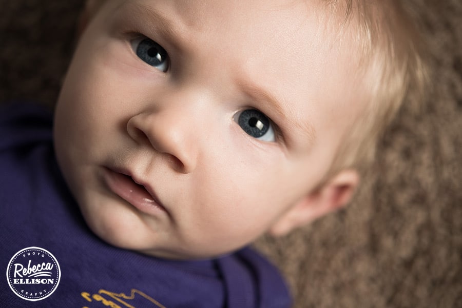Close up of a baby boy during a 6 month portraits session with Seattle baby photographer Rebecca Ellison