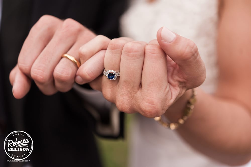 Bride and groom show off their wedding rings photographed by Seattle wedding photographer Rebecca Ellison