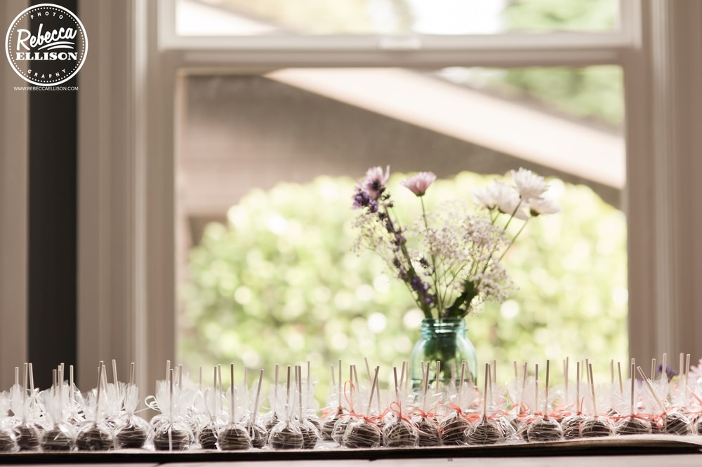 Cocktail glasses lined up against a window at an intimate backyard wedding photographed by Seattle wedding photographer Rebecca Ellison