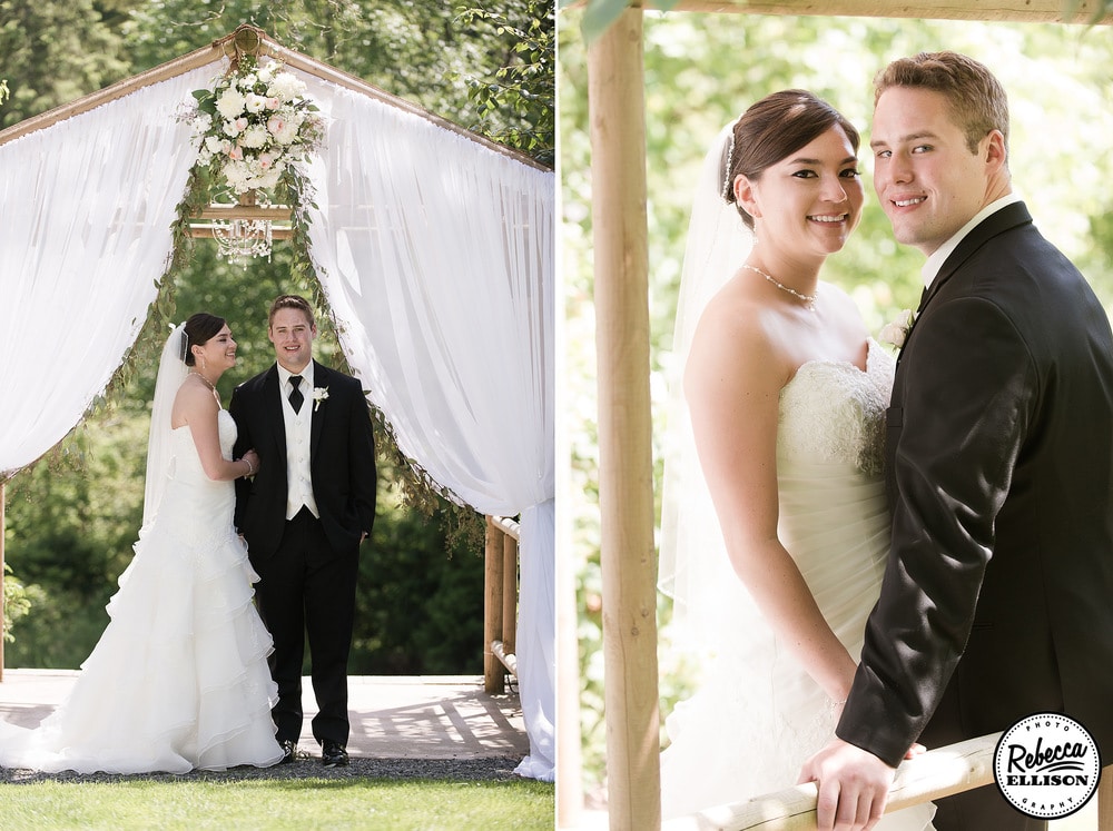 Outdoor garden wedding portraits featuring a wooden arbor with white billowing curtains and a white strapless dress with a tiered lace skirt photographed by Rebecca Ellison Photography