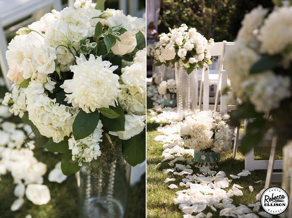 Wedding aisle lined with vases of varying height filled with white flowers and crystals photographed by Seattle wedding photographer Rebecca Ellison
