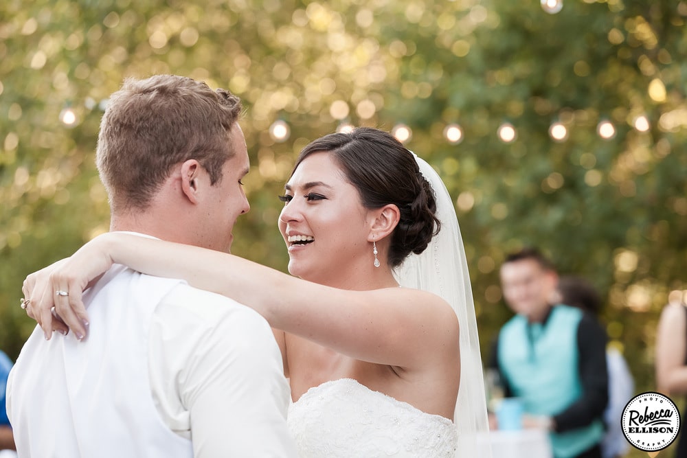 Bride and groom dance at their outdoor wedding reception photographed by Seattle wedding photographer Rebecca Ellison