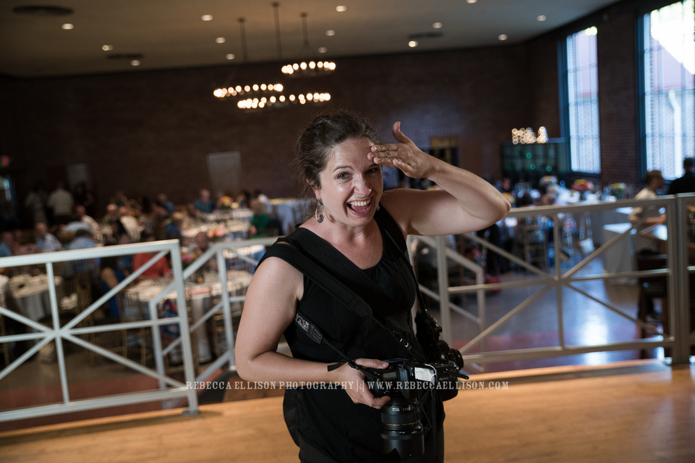 Wedding behind the scenes : standing in on a light test for the first dance lighting, while having fun showcasing how hot it was in the venue on a 90 degree day