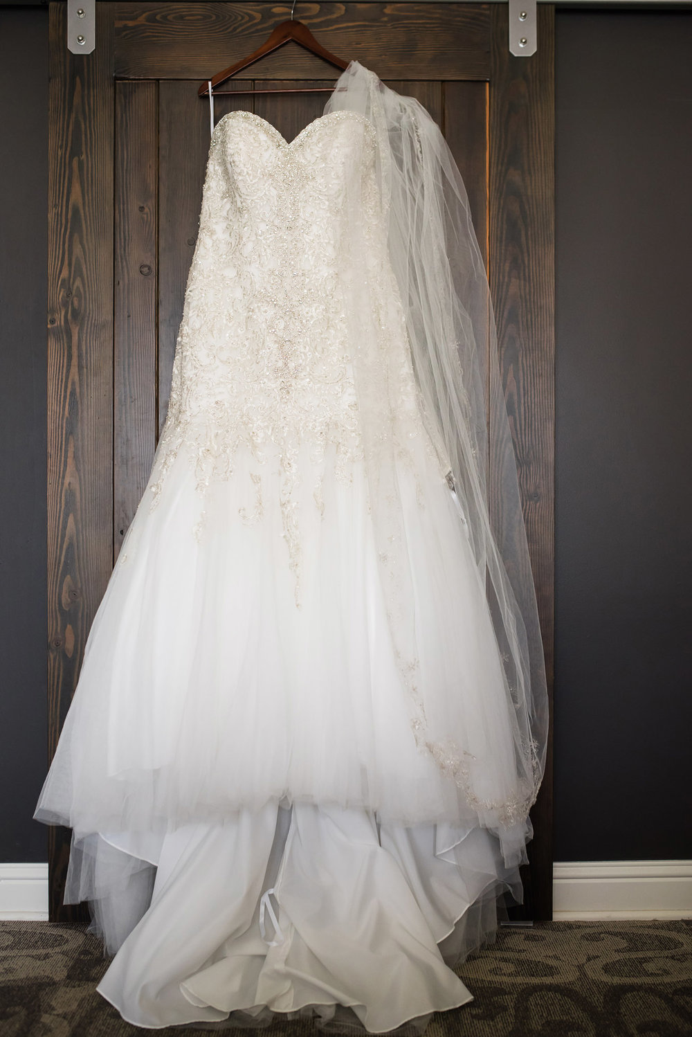 Wedding dress hanging at Hotel Ballard in Seattle