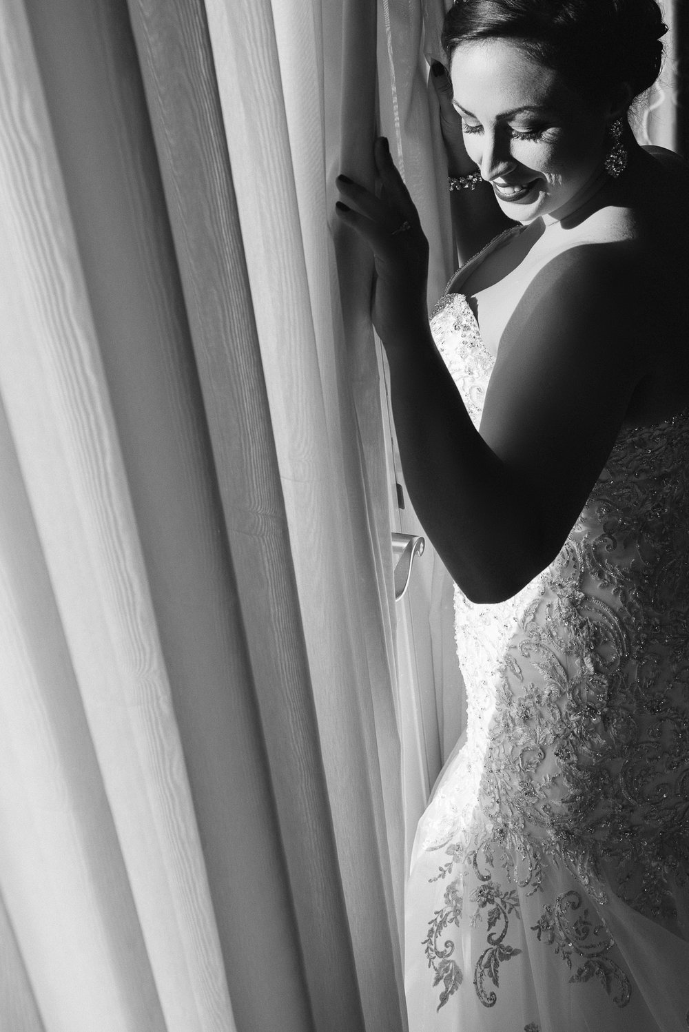 black and white portrait of bride getting ready at hotel ballard before her Fremont Foundry Wedding in Seattle
